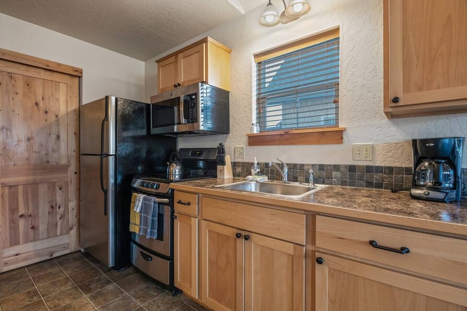 Adorable delightfully detailed kitchen.
