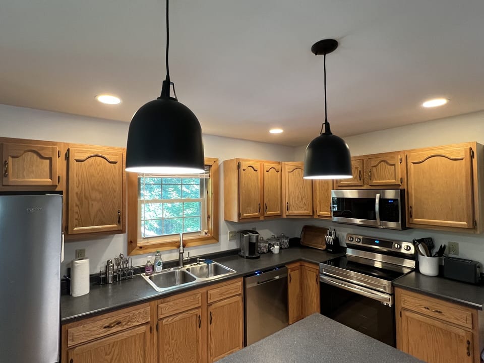 New kitchen appliances and an island that seats three.