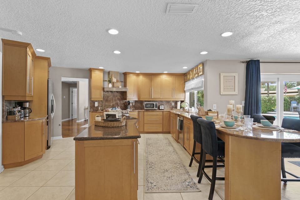 Kitchen with seating for 4 complete with coffee bar