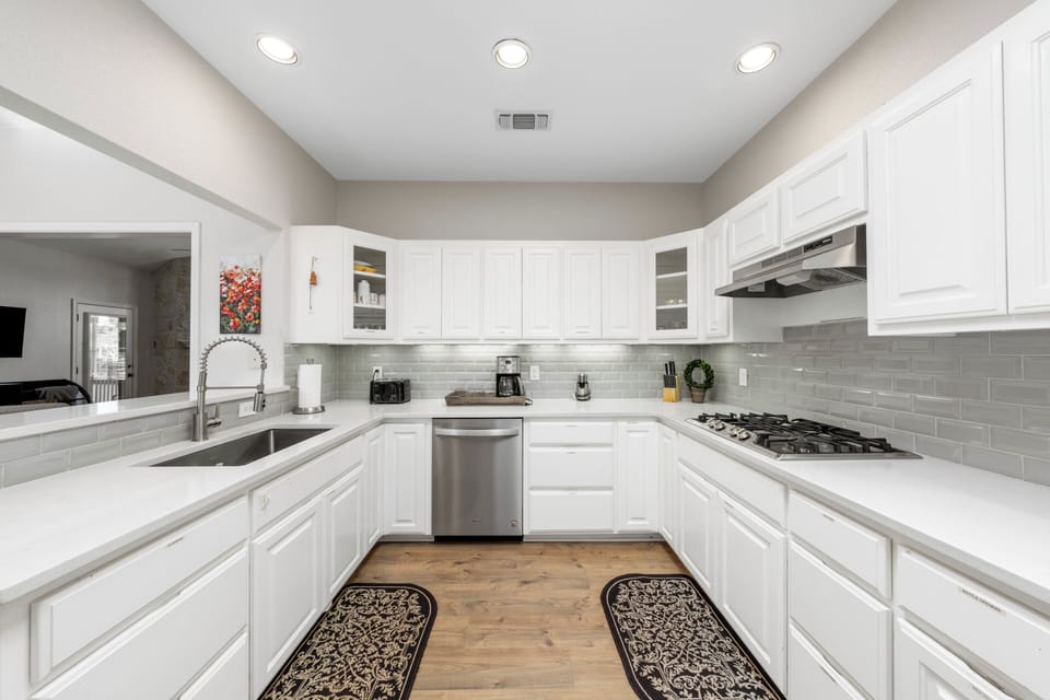 Fully stocked kitchen with gas burning stove
