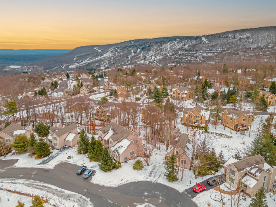 Relax in the heart of this snowy Pocono ski village—just minutes from the slopes, trails, and cozy cabin comforts.