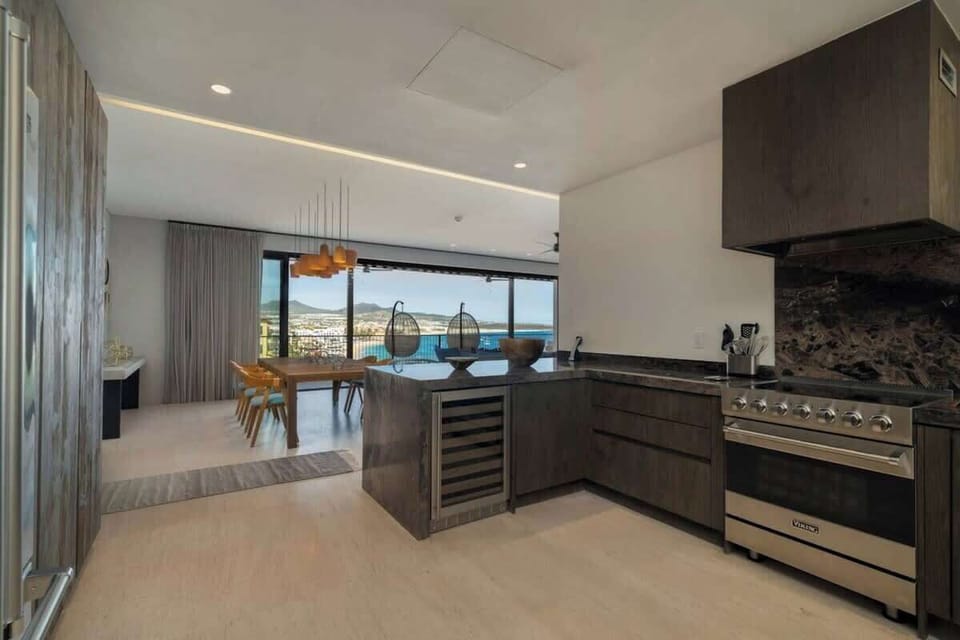 Fully equipped kitchen with natural quartzite countertops, Viking appliances, a wine fridge, dishwasher, and everything you need to enjoy a meal with your family and friends. We also offer at-home, private chef services.
