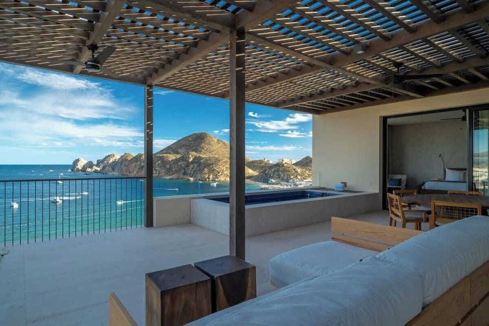 Outdoor terrace with panoramic ocean views of the Sea of Cortez.  Featuring a plunge pool, outdoor dining & plenty of seating to relax. The terrace doors pocket into the wall to create a seamless indoor-outdoor living experience. 