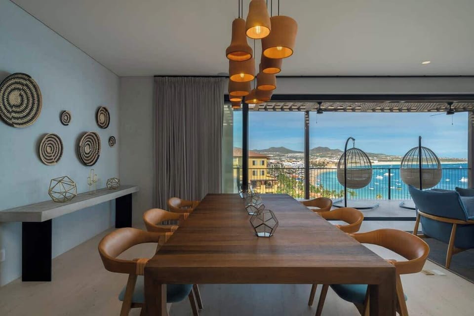 Indoor dining space with seating for 6, enjoy panoramic views of the Sea of Cortez. The terrace doors pocket into the wall to create a seamless indoor-outdoor living experience with plenty of seating to relax, work or enjoy a meal.