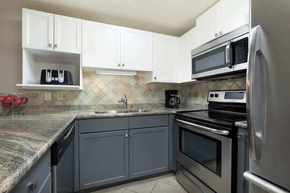 - Stylish kitchen with modern appliances and ample prep space  
- Two-tone cabinetry adds contrast and contemporary flair  
- Ready for quick breakfasts or hearty mountain dinners 