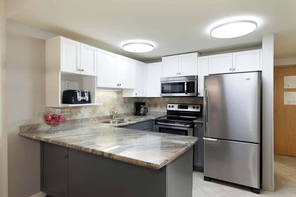- Sleek kitchen with stainless steel appliances and granite counters  
- Fully stocked for cooking and dining convenience  
- Perfect for extended stays and cozy nights in  