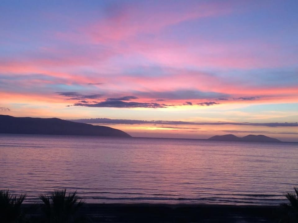 Sunset. Frontal view from the living room and balcony