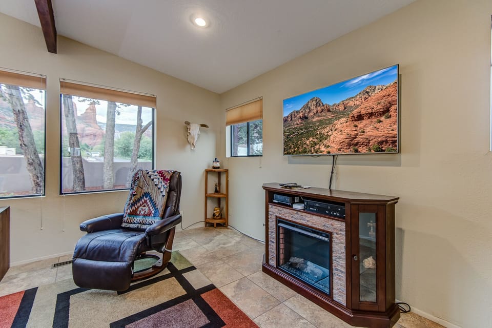 Living Room with 60" Smart TV and Electric Fireplace