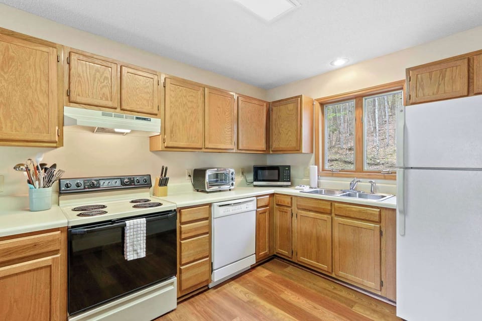 With a complete array of amenities, the kitchen opens to a charming open floor plan, incorporating a dining and living space, promising evenings filled with lasting memories.