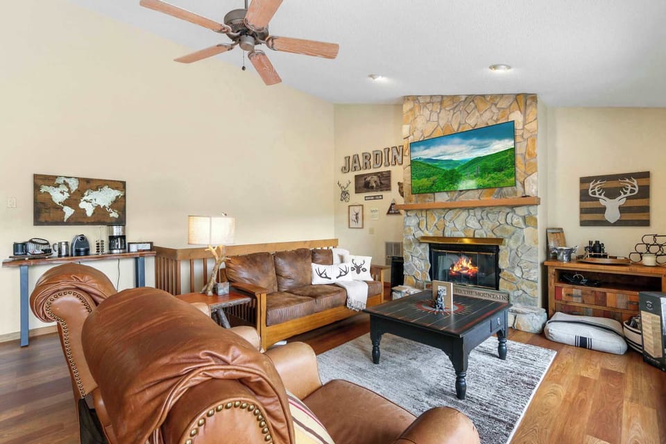 Fireside Retreat: Embrace the living area adorned with a fireplace, providing a comforting and inviting space for relaxation and warmth.