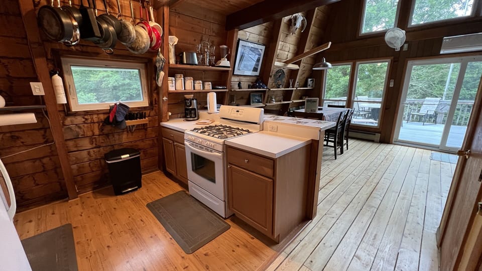 Kitchen with all the pots, pans and storage containers you need... Spices too. 