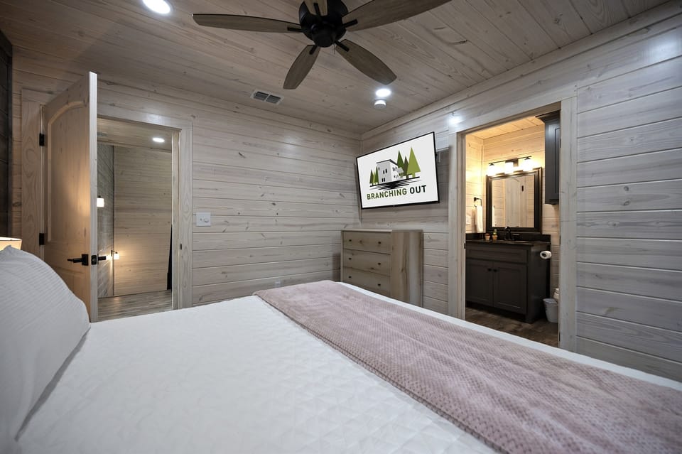 King bedroom equipped with modern comforts and entertainment options.
