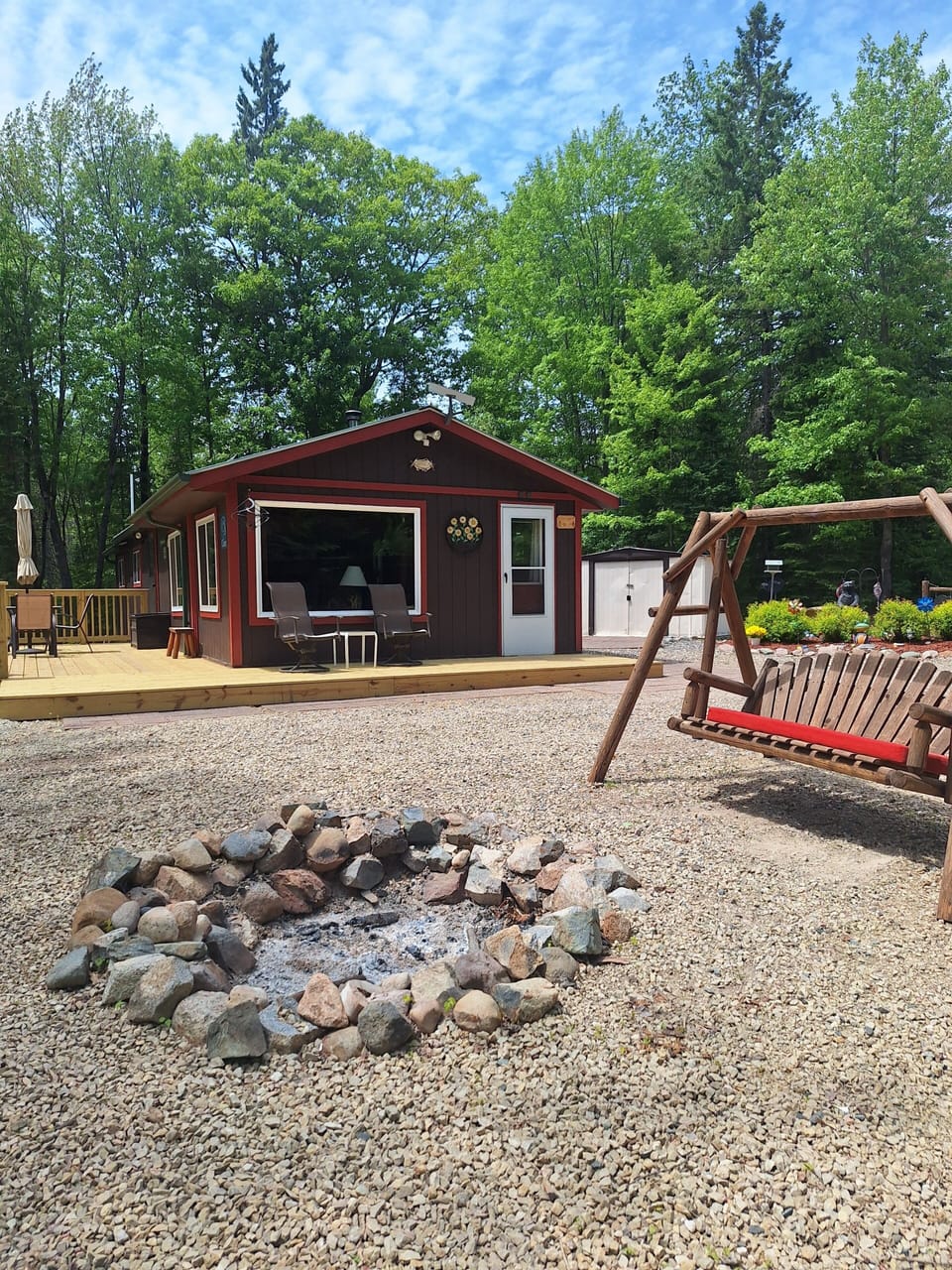 Firepit, swing and plenty of chairs for your relaxation.