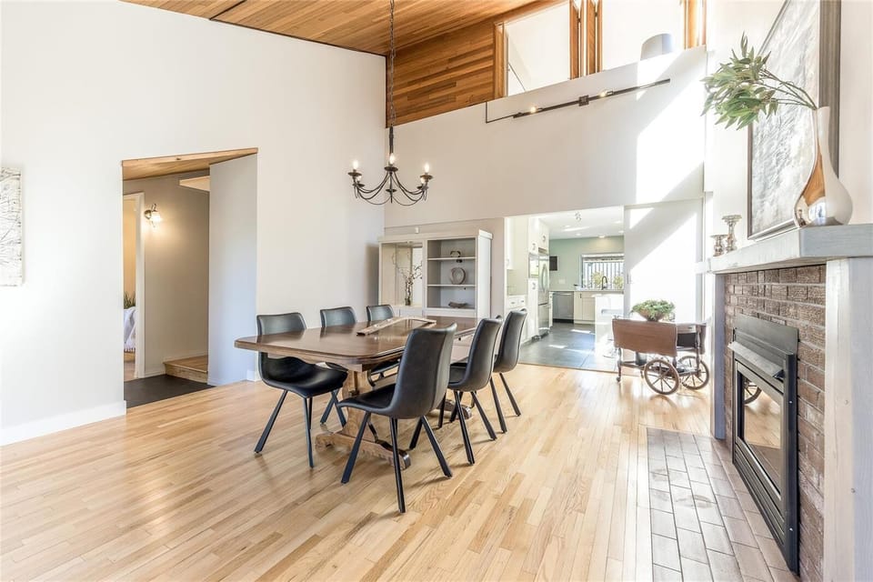 Dining area with vaulted ceilings.