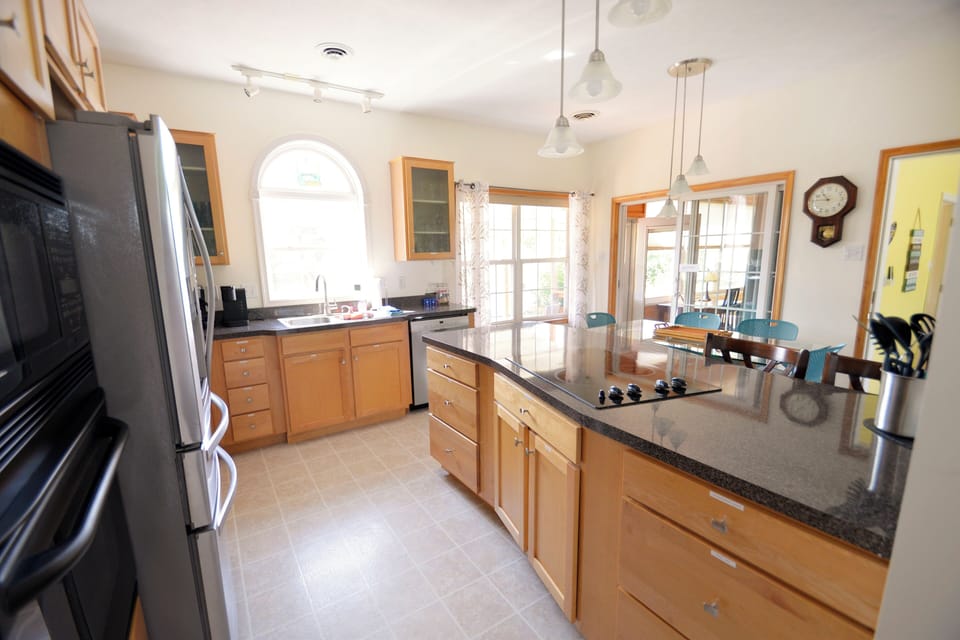 Kitchen with a cook top and modern appliances