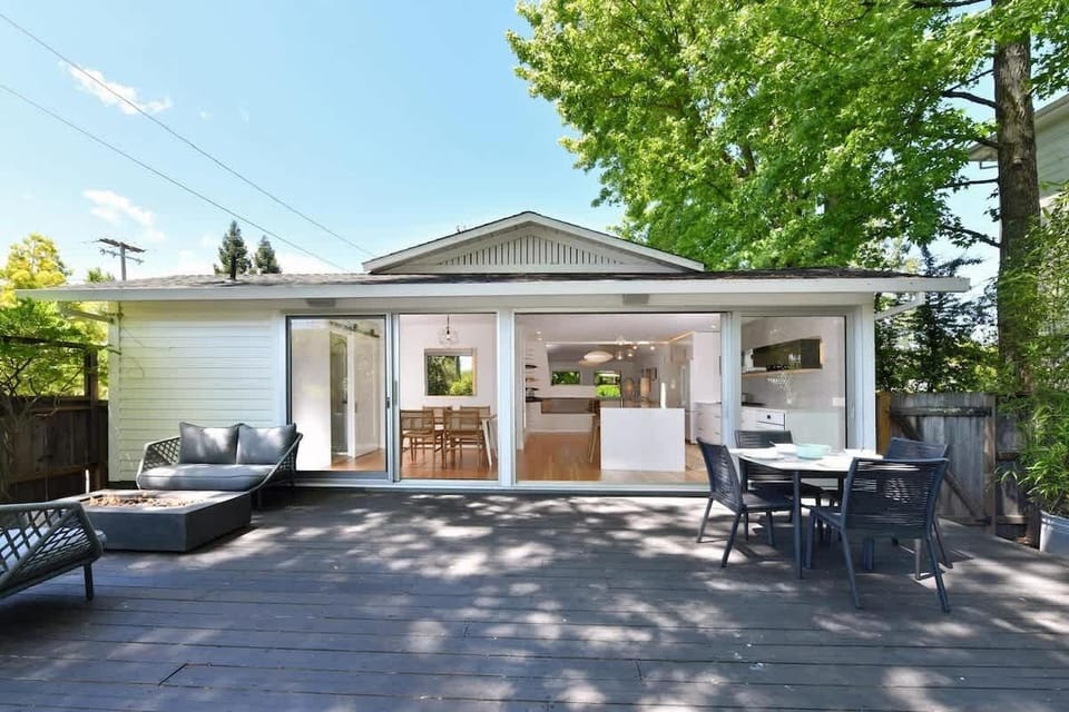 Spacious backyard patio with cozy seating and dining area