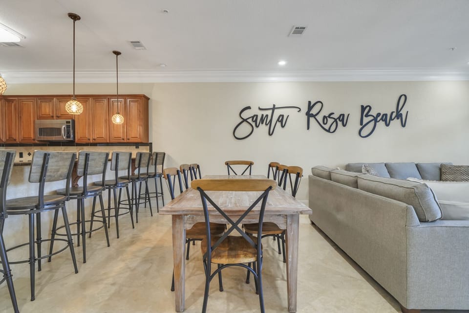 Dining Room Area, Table has Seating for 8 and Bar has Seating for 6.  