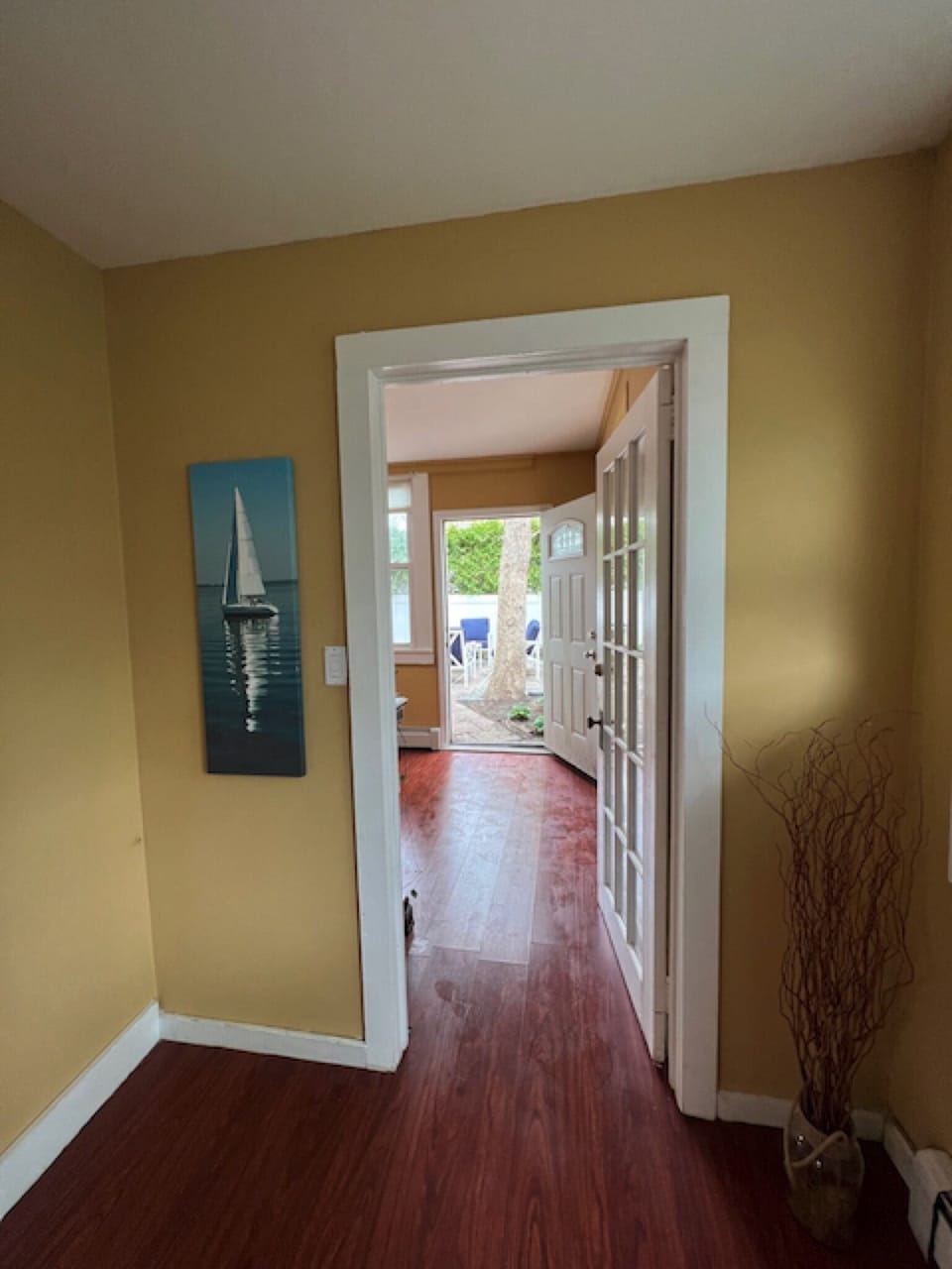 Entrance to bedroom, looking past to private backyard. 