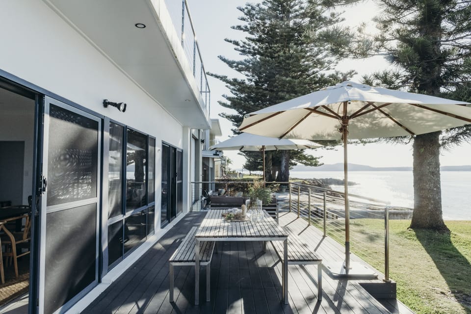Waterfront deck, plenty of room for enjoying al fresco dining or just to relax.