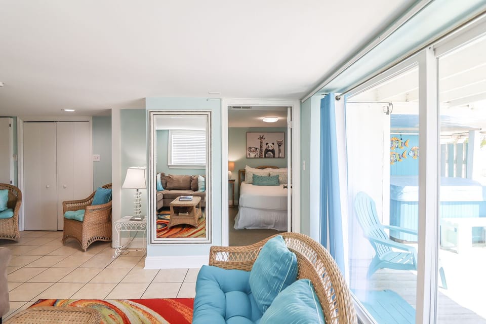 Living Room with View of Deck and Full Bedroom