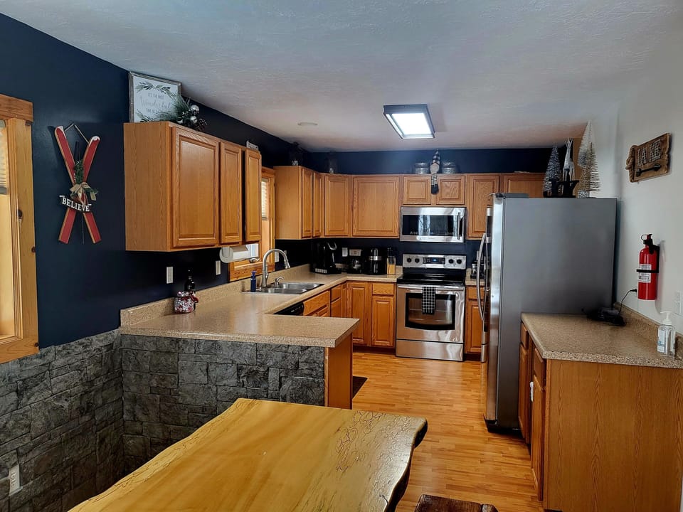 The large kitchen is fully stocked with everything guests might need.