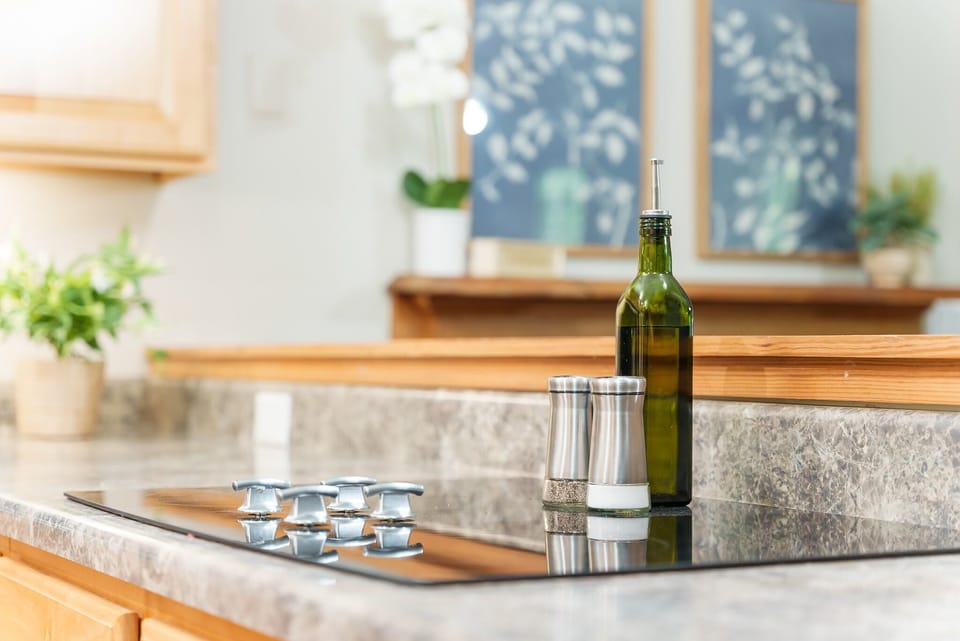 Enjoy cooking on the glass top stove. Some cooking essentials are provided.