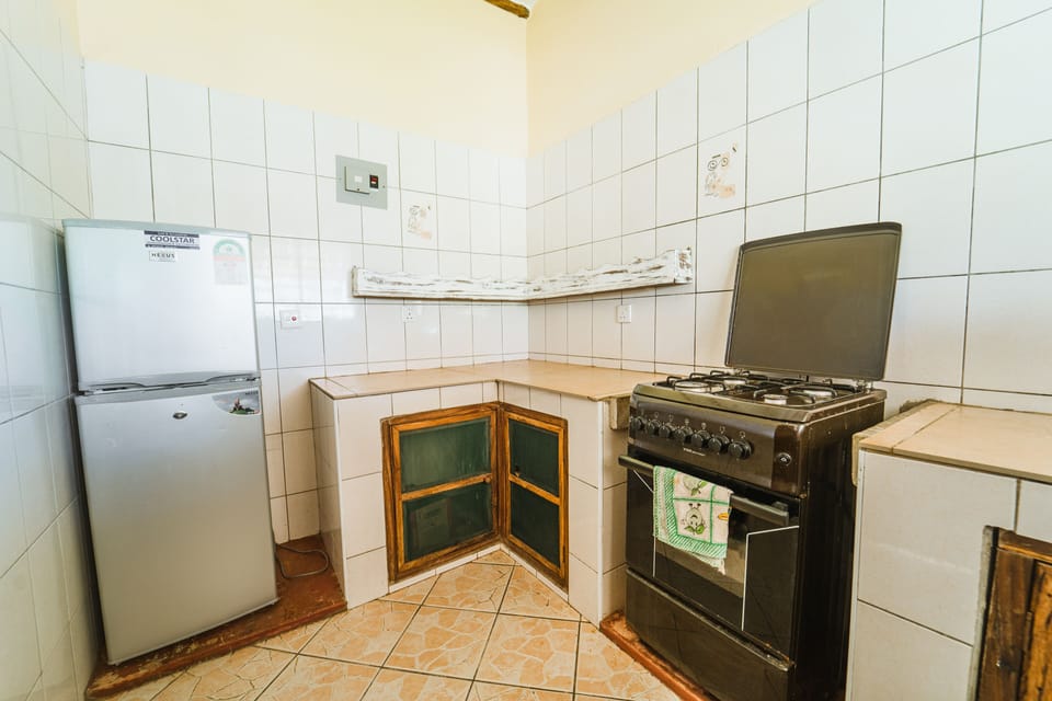 Classic Single Room, 1 Double Bed, Pool View | Private kitchen | Dining tables