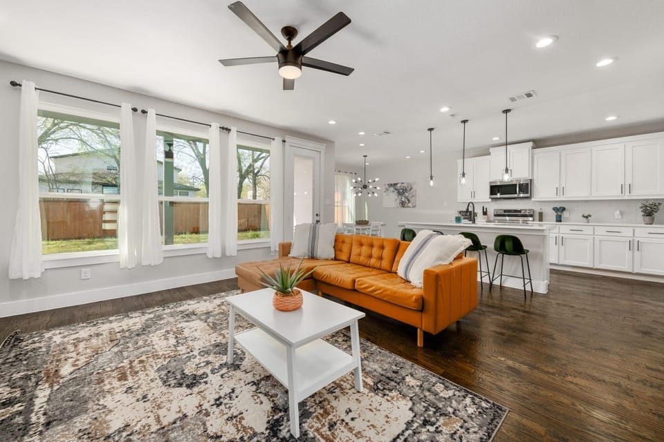Living room features a 75" HDTV and an electric fireplace to cozy up next to! 