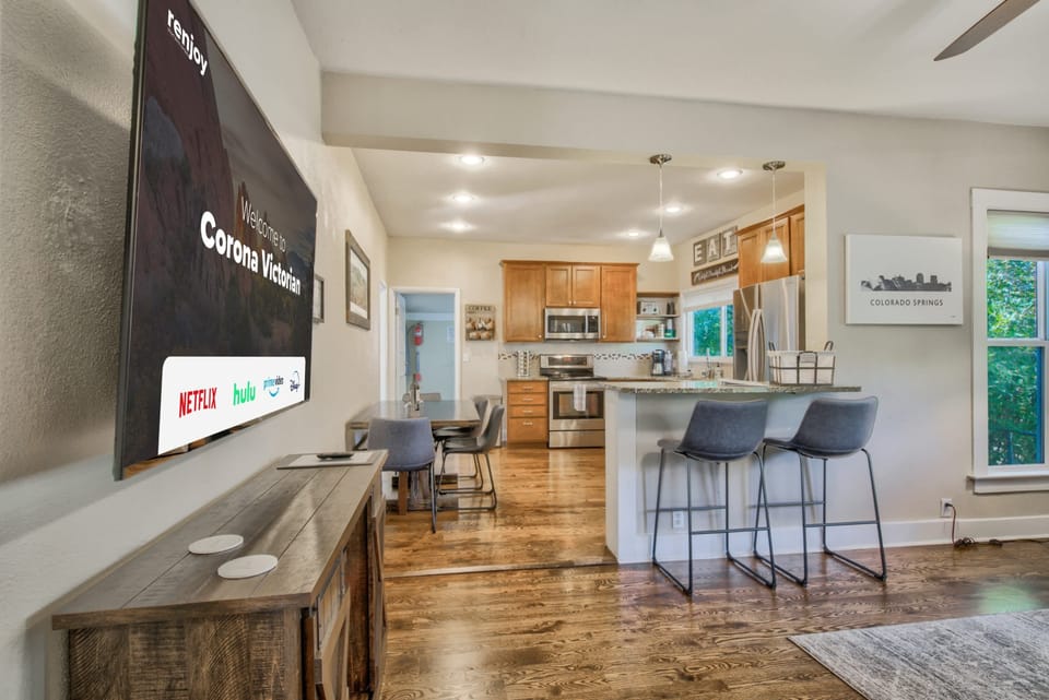 Ample Space to Enjoy! Our 65-Inch Smart Roku TV is Perfectly Positioned, Conveniently Accessible from the Kitchen and Living Room. Watch Anywhere, Anytime!