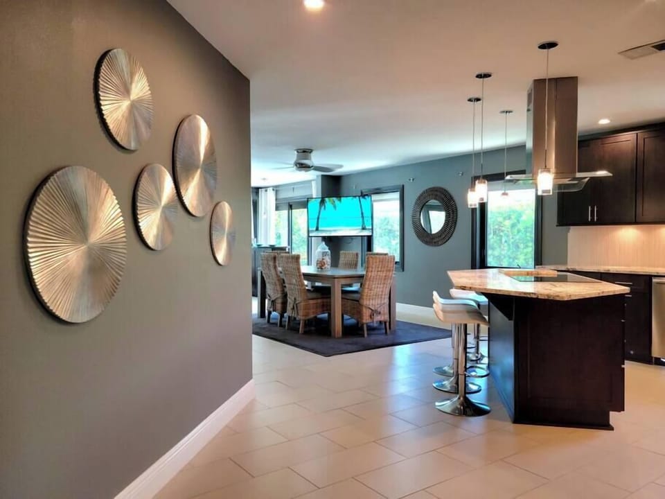 Opens up to Kitchen, dining and into a full view of the pool deck. 