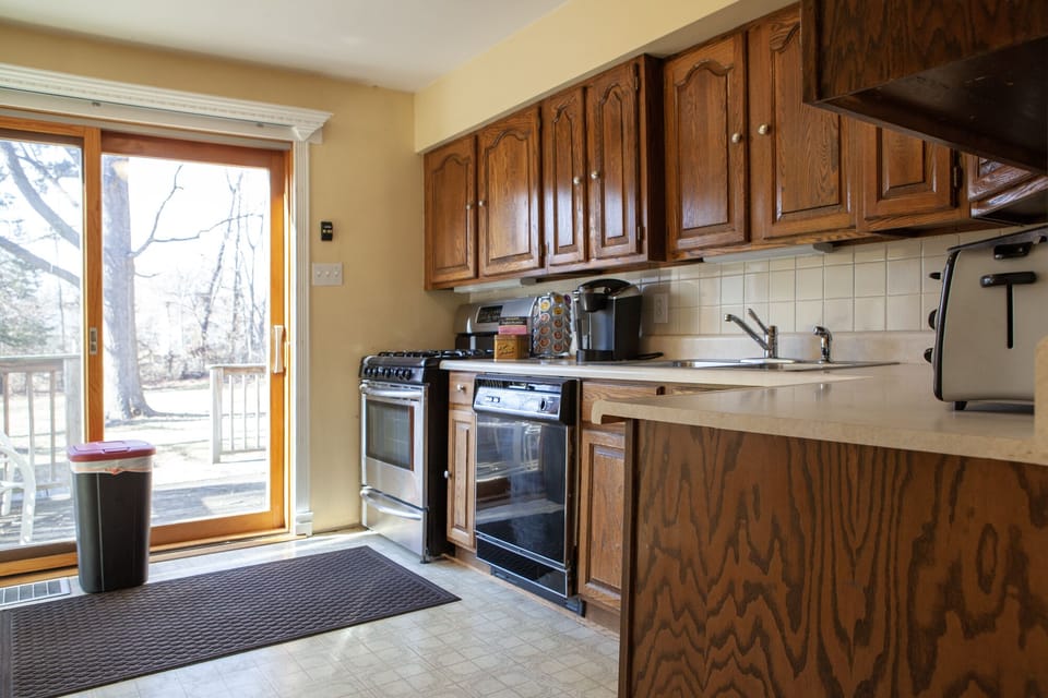 Kitchen with deck access through sliding glass door