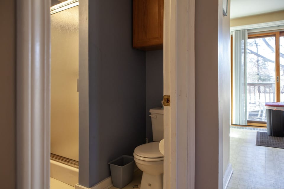 Bathroom and glimpse of kitchen 
