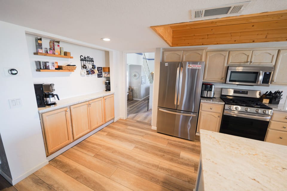 Remodeled kitchen, granite countertops, a large island, Kohler sink and faucets.