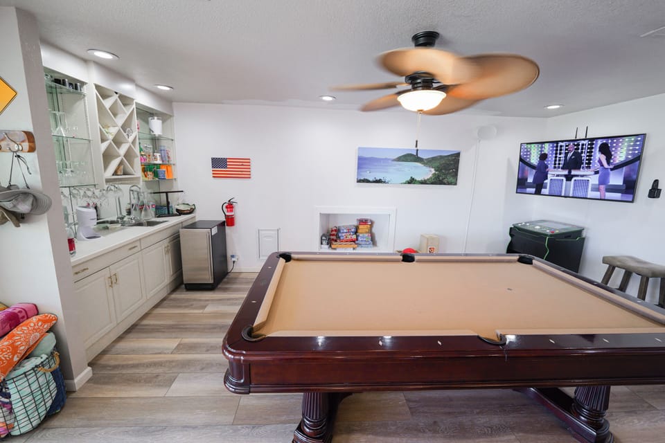 Brunswick pool table, mini-Bar, Ice Maker, LVT flooring, Golden Tee video golf.