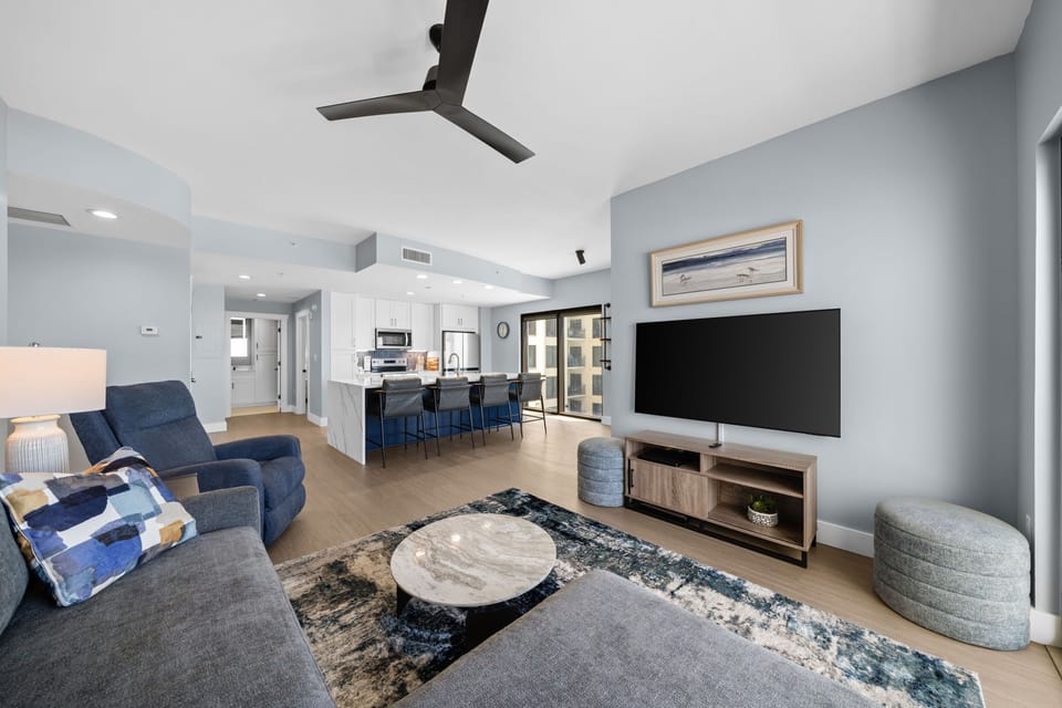Sink into plush seating while your favorite shows play on the large TV. The open kitchen beckons for morning coffee.