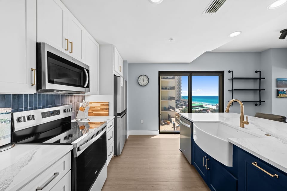 Prepare your favorite meals in this modern kitchen while enjoying stunning ocean views through your private balcony doors.