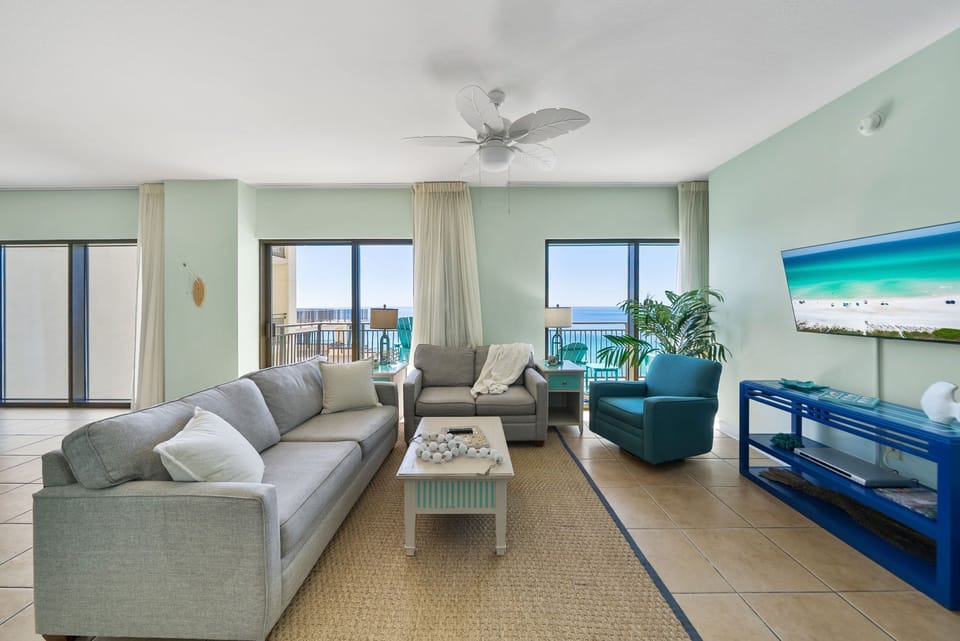 Relax in your bright living room with ocean views, comfy seating, and coastal decor that brings the beach indoors.