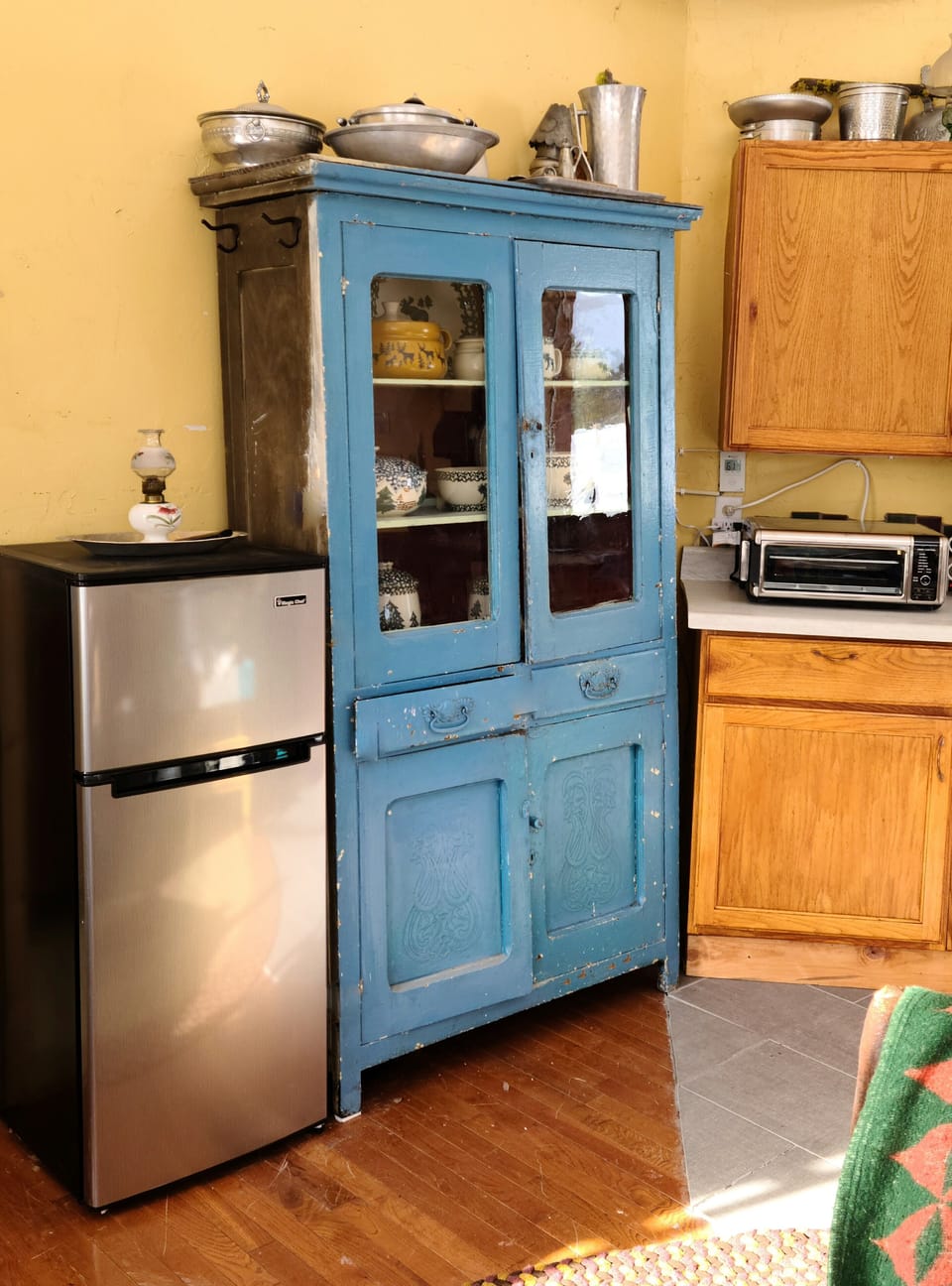 Frig, Air Fryer and propane stove top. Dishes, pots and pans provided 