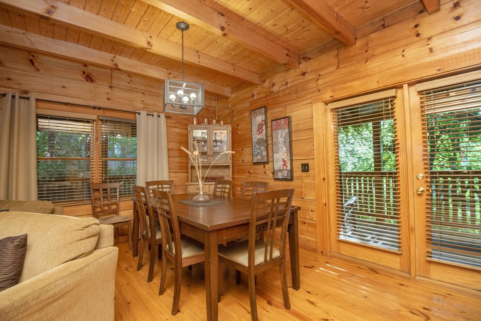 Large dining table will seat up to 8, with a table outside on the deck seating 8