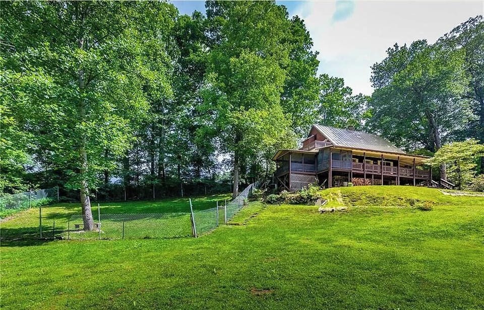 View of fenced yard and screen in porch