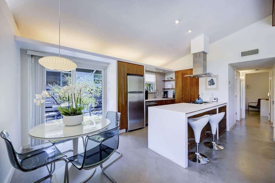 The dining table seats 4 + seating for 2 at the kitchen island.
