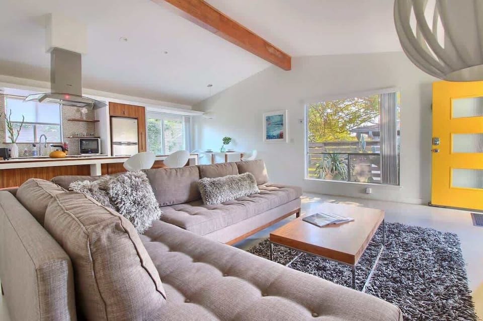 Welcome to the Gold Door: A  Bright Mid Century Refuge with Fenced Yard