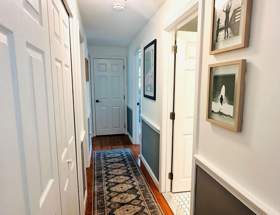 Back in the main living space, past the kitchen, you will find three more bedrooms off of the hallway - 671 Great Fields Rd Brewster Cape Cod - Beach Glass - New England Vacation Rentals