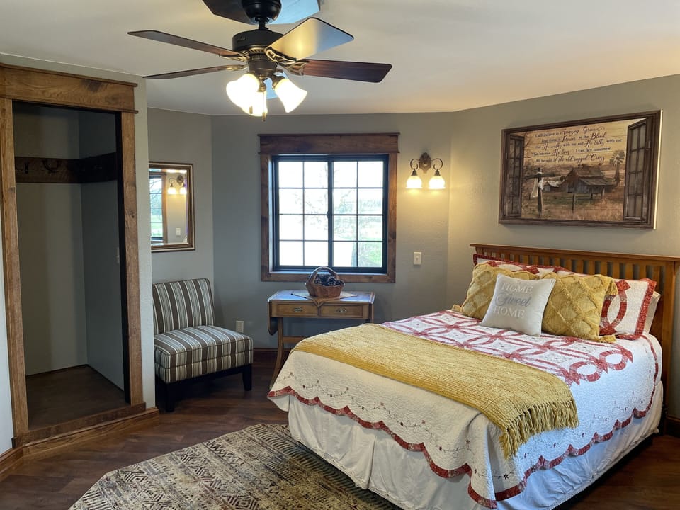 Bedroom with a queen bed and a GREAT view out the windows! 
Closets and storage.