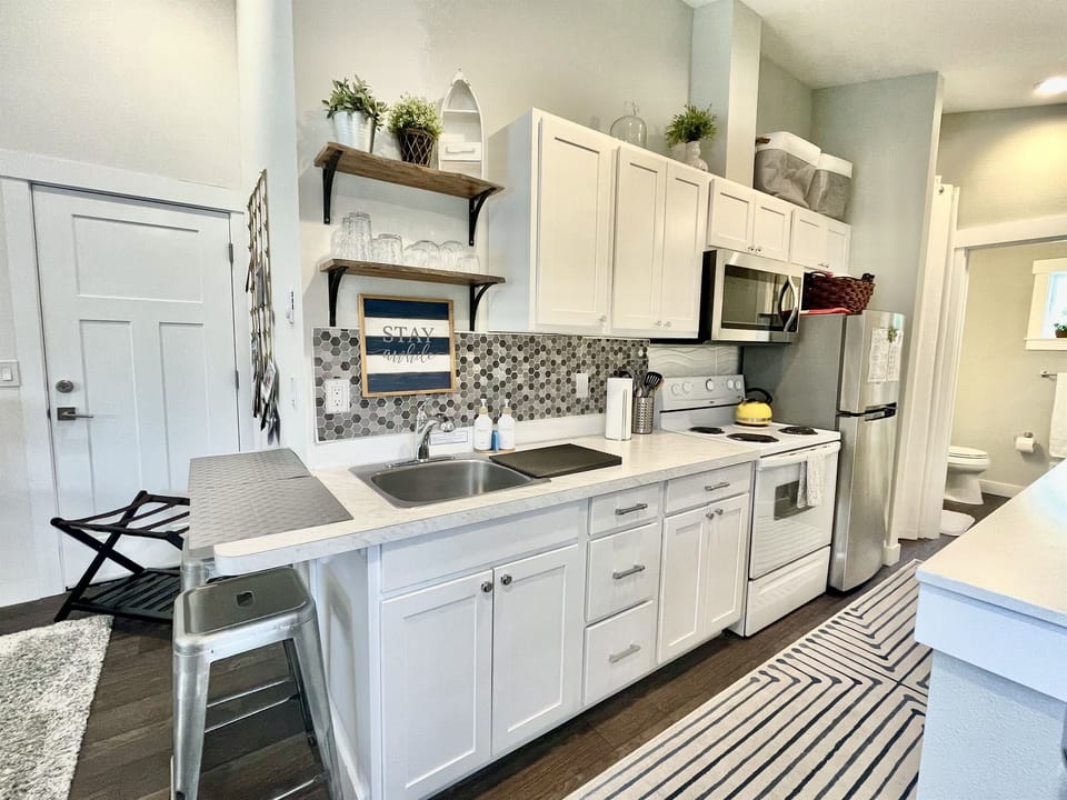 Full kitchen with stove and refrigerator!