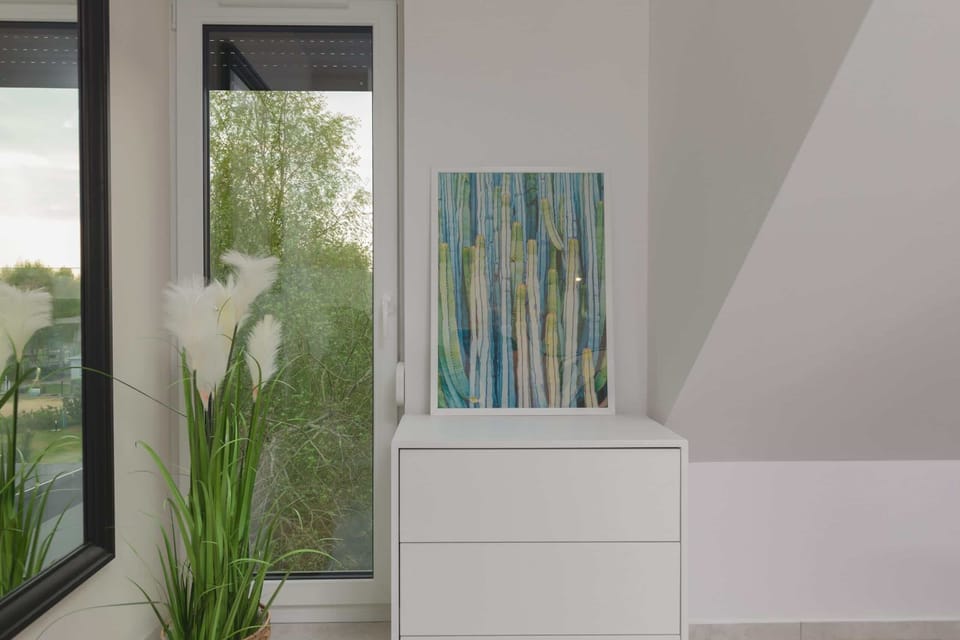 Chest of drawers and mirror in the bedroom.