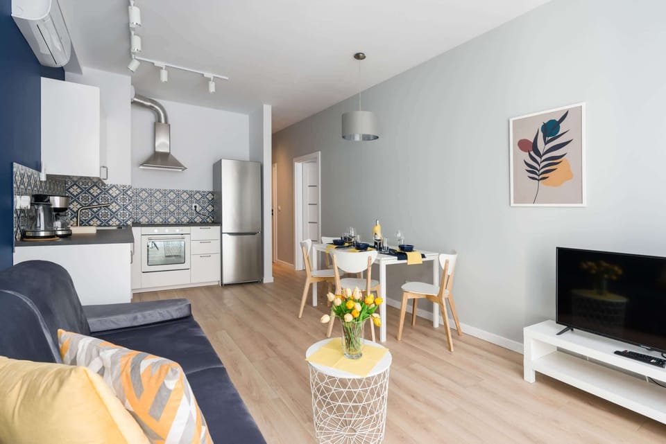 Kitchenette with dining area and living room.
