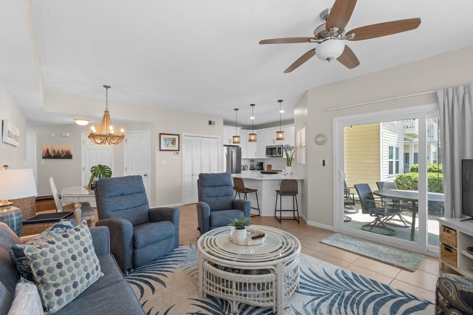 Relax in your bright, coastal-inspired living space with plush seating and tropical touches that flow seamlessly to your private patio.