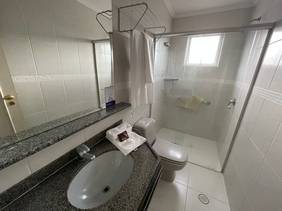 Shower, hair dryer, towels, toilet paper