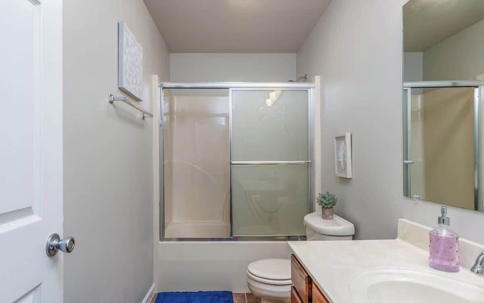 Bright and functional bathroom with a full tub/shower combo—stocked with essentials for a comfortable stay.